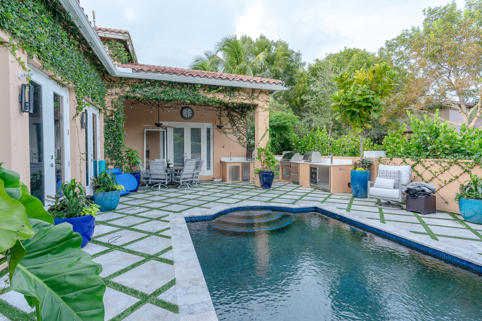 Mediterranean estate outdoor kitchen with pool — Boca Raton, FL